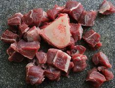 pieces of meat sitting on top of a counter