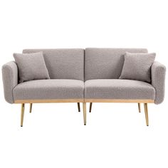 a grey couch with two pillows on it and some wooden legs in front of the couch