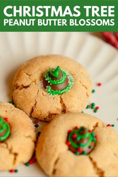 three christmas tree peanut butter blossoms on a plate