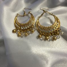 Elegant Boho Simulated Diamond Dangling Earrings, New Without Tags White Metal Chandelier Earrings, Bohemian Gold Crystal Earrings For Party, White Metal Drop Earrings, Festive White Metal Chandelier Earrings, White Metal Danglers For Celebration, Golden Earrings Indian, Desi Earrings, Diamond Dangling Earrings, Jhumka Designs