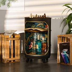 an old fashioned liquor cabinet is decorated with bottles and other decorative items, along with books