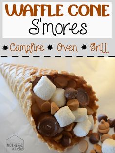 a waffle cone is filled with marshmallows and s'mores