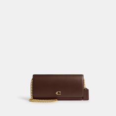 Form function and craftsmanship combine on our refined leather Evie Long Wallet. Detailed with our Signature hardware it has a convenient outside pocket and a spacious interior with multiple card slots a billfold compartment and a zip pocket for coins plus space for the largest size phone. Toss in a bag carry as a clutch or wear crossbody with the detachable gleaming chain strap. | Coach Evie Long Wallet With Chain - Women's Designer Crossbody - Brass/maple Brown Leather Wallet On Chain With Removable Pouch, Brown Rectangular Wallet On Chain With Removable Pouch, Brown Wallet On Chain With Removable Pouch, Timeless Rectangular Wallet On Chain For Everyday Use, Coach Luxury Wallet On Chain For Everyday Use, Luxury Coach Wallet On Chain For Everyday Use, Luxury Coach Wallet On Chain For Daily Use, Elegant Brown Coach Wallet, Coach Luxury Wallet On Chain For Formal Occasions