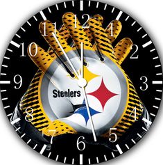 a clock with the logo of the pittsburgh football team on it's face and hands