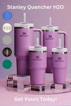 four purple tumblers sitting on top of a glass stand with the words stanley quencher h2o get yours today