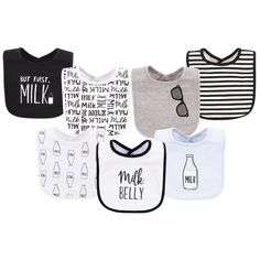 six baby bibs with different designs and words on them, all in black and white