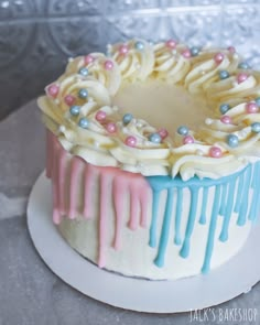 a cake decorated with icing and sprinkles