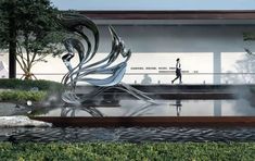 an artistic sculpture is in front of a building with people walking past it and reflecting on the water