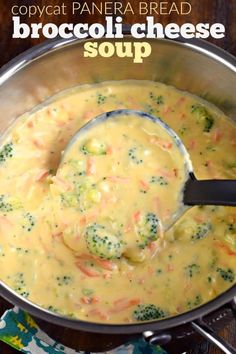 broccoli cheese soup in a pot with a ladle