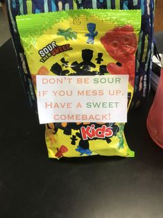 a bag that has some kind of candy on it with a sign attached to it