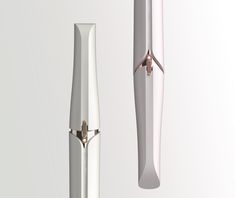 two different types of pens are shown in this image, one is white and the other is silver