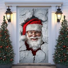 an image of santa clause coming out of a hole in the wall with christmas trees