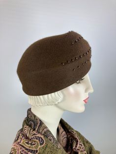 This pretty turban style women's hat is a statement. It's handmade and hand blocked on a vintage hat block. The hat is a pretty milk chocolate brown wool felt and is embellished with matte and shiny brown glass beads that accentuate the hat's lines and gives it a distinctly vintage vibe. Great for fall and winter - you'll turn heads with this little number. Wear it casually or dress it up. Completely hand made and one of a kind. An inner grosgrain ribbon helps keep makeup off of the hat and it f Hat Blocks, Beaded Hat, Turban Style, Turban Hat, Vintage Hat, Final Touch, Vintage Vibe, Beautiful Hats, Milk Chocolate