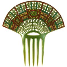 Wonderful Art Deco Eygptian Revival Comb of clear celluloid overlaid with green. The design is then pierced, overpainted and set with pave stones in red and green. France 1930's. Excellent condition. 7" x 7". Historical Accessories, Retro Updo, Antique Hair Combs, Bijoux Art Deco, Art Deco Hair, Spanish Club, Vintage Bridal Shower, Green Wedding Colors, Vintage Hair Clips