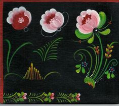 a painting with flowers painted on it in red and green colors, sitting on a black surface