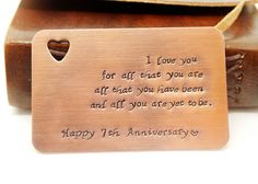 a metal tag that says i love you for all that you are affixed to