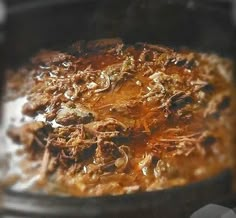 the food is being cooked in the slow cooker