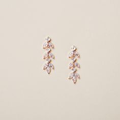 This pair of leaf-shaped crystal earrings are perfect for brides who prefer a low profile yet graceful look. It can also serve as daily earrings or the best gift for your bridesmaids. Details * Finish: Silver, Gold, or Rose gold * Measurement: 1/2 x 1 1/4 inches (1.2 x 3.2 cm) * Model is wearing rose gold. Shipping Information * Most items listed in my store are in stock and can be processed in 3-5 business days. For a few items that are temporarily out of stock or require longer processing time Bridal Dangle Earrings, Rose Gold Earrings Wedding, Gold Hair Vine, Gold Hair Pin, Dangle Earrings Wedding, Gold Earrings Wedding, Crystal Bridal Earrings, Bride Hair Accessories, Earrings Bridesmaid