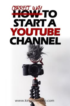 a hand holding a camera with the words how to start a youtube channel on it