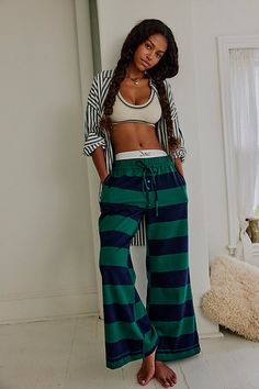 We’re living in these comfy cotton lounge pants from Intimately, featured in a flared silhouette with wide stripes and an adjustable waistband for endless wear in or out of the house. **Fit:** Relaxed, flared, mid-rise **Features:** Comfy cotton fabrication, wide stripes, elastic waistband with adjustable drawcord, button-fly details **Why We | You Wish Flare Pants by Intimately at Free People in Blue, Size: M Blue Striped Pants, Wide Stripes, Adjustable Waistband, Navy Green, Navy And Green, Striped Pants, Lounge Pants, Flare Pants, Active Wear For Women