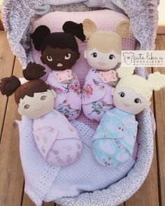 a group of stuffed animals sitting on top of a blanket