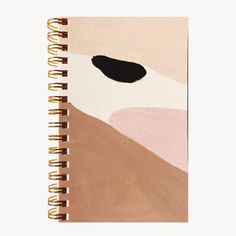 a spiral notebook with an abstract painting on it