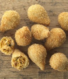 several pieces of fried food on a wooden table