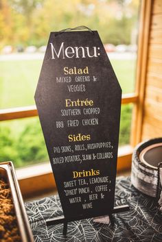 a menu board sitting on top of a table