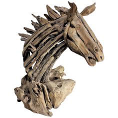 a wooden horse head made out of driftwood