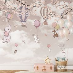 a baby's room decorated with balloons, animals and other items in the sky