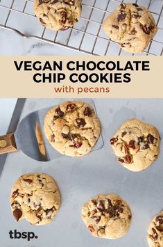 vegan chocolate chip cookies with pecans on a cooling rack and in the background is a cookie sheet