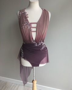 a mannequin with a purple dress on it