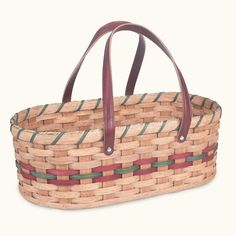 a woven basket with leather handles is shown on a white background in this image, there is also a red and blue stripe around the handle