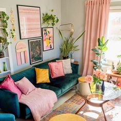 a living room filled with lots of furniture and colorful pillows on top of it's couches