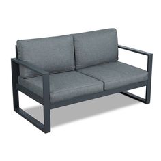 a gray couch sitting on top of a wooden frame