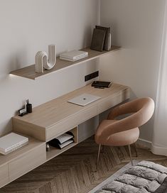 a desk with a laptop on it and a chair next to it in front of a window