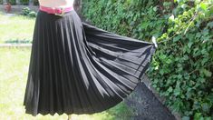 "This pretty pleated skirt vintage is perfect for spring, autumn and summer! DETAILS: rare skirt vintage skirt made in West Germany skirt midi pleated skirt fabric: wool;  polyester color: black side zipper almost circle skirt skirt with lining Very good condition. Measurements lying flat are: Length: 28,5\" / 72cm Waist: 14\" / 35,5cm PLEASE NOTE: \"Laying flat\" means that waist  NEED TO DOUBLED Estimated size: EUR42 / UK14, but refer to measurements  Belt in photo is not included." Black Accordion Pleated Skirt For Summer, Retro Black Skirt For Spring, Vintage Full Skirt With Accordion Pleats, Retro Black Pleated Skirt, Retro Black Long Skirt, Vintage Pleated Lined Skirt For Spring, Spring Vintage Long Pleated Skirt, Vintage Long Pleated Skirt For Spring, Black Vintage Skirt For Summer