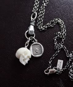 This a limited edition necklace that I've made combining a hand carved bone bead in the form of a perfectly detailed human skull and my 'mortality' amulet. Both were hung on a sterling silver charm holder and then on a nice solid Rolo chain. Mortality: this amulet is an impression of an antique wax letter seal which dates to the early 1800's. It features the image of a human skull. The text surrounding it states in French 'j'ai ete je suis, tu seras' or As you are, so once was I. Reminding us th Seal Jewelry, Wax Seal Jewelry, Antique Wax, Bone Pendant, Gothic Necklace, Necklace Antique, Skull Carving, Skull Jewelry, Skull Necklace