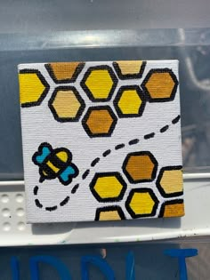 an image of a bee on the side of a vehicle with honeycombs painted on it