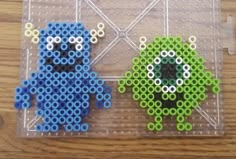 two pixelos sitting on top of a table next to each other with different colored beads