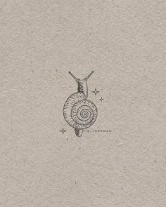 a drawing of a snail on top of a piece of paper with stars around it