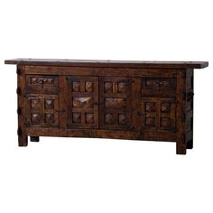 an old wooden sideboard with many drawers