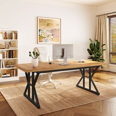 a computer desk sitting on top of a hard wood floor next to a book shelf