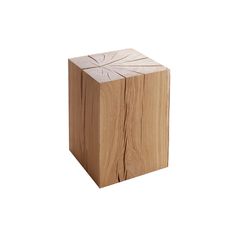 a wooden block sitting on top of a white background