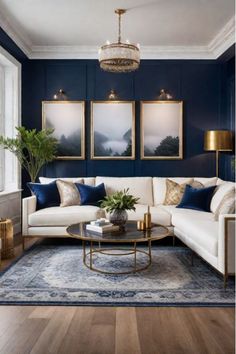 a living room with blue walls and white couches, coffee table and paintings on the wall