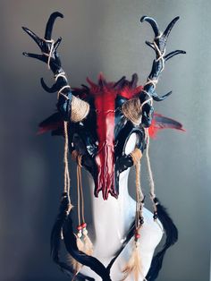 This cosplay headdress is inspired by ancestral shaman costumes, viking weddings and ritual Salem switch costumes with deer antlers and skulls and feathers   You have the option to pick Ram horns or deer antlers! I N C L U D E D Masks come with thick black elastic band attached. S I Z E  Adult size. Detailed dimensions available upon request. C U S T O M I Z A T I O N If you would like to color & embellish the mask to match your costume/dress, choose custom color and get in touch, we love to wor Deer Antler Headdress, Horned Fantasy Headpiece For Festival, Fantasy Horned Headpiece For Festival, Black Bohemian Headpiece For Cosplay, Bohemian Halloween Costume Headpiece, Bohemian Headpieces For Halloween Fantasy Events, Bohemian Headpieces For Halloween Cosplay, Viking Weddings, Deer Skull Mask