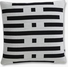 a black and white pillow with lines on it