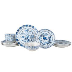 a blue and white dinner set on a white background