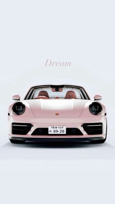 a pink porsche sports car with the words dream above it