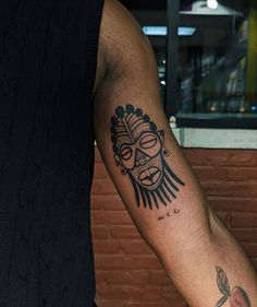 a man with a tattoo on his arm